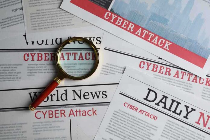 1897700383 featured image Newspapers with 'Cyber Attack' headlines and a magnifying glass.