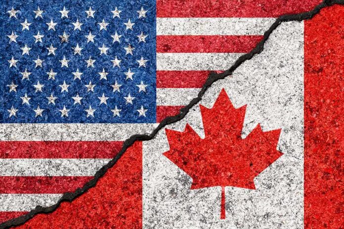 USA and Canada flags with a crack dividing them