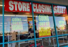 Store closing sale with going out of business signs.