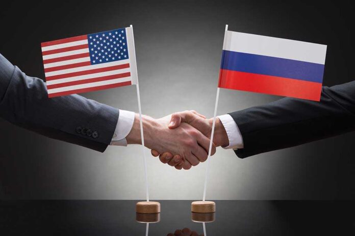 282618053 featured image Two people shaking hands with US and Russian flags