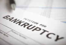 Petition for bankruptcy document with pen.