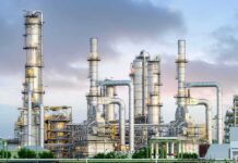 Industrial plant with metal towers and pipes.