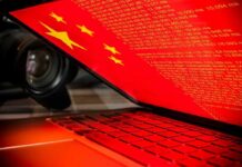 Laptop screen displaying Chinese flag and code