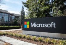 Microsoft sign with office buildings and trees