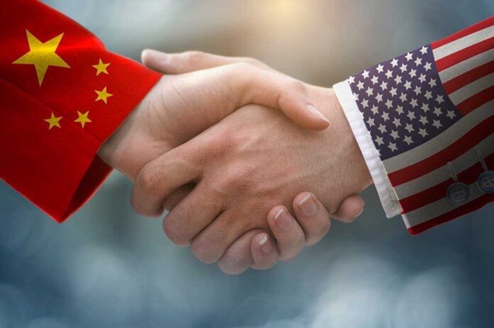 1431101585 featured image Handshake with China and USA flag sleeves.