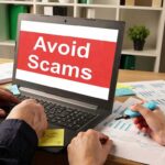 Laptop displaying avoid scams message on screen