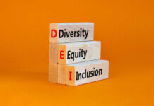Wooden blocks with letters DEI diversity equity inclusion