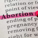 Abortion highlighted in a dictionary with a pink marker