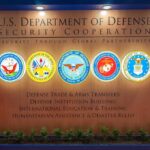U.S. Department of Defense Security Cooperation display with logos