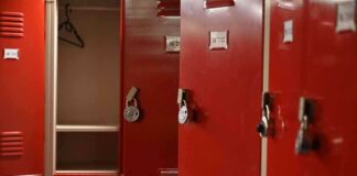 Red lockers with padlocks one open with hanger