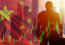 Man with chart and China flag background