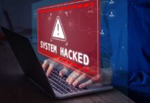 Warning sign System Hacked on laptop screen