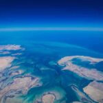 Aerial view of coastline and ocean