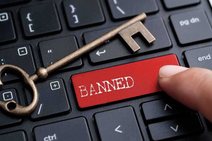 566431402 featured image Finger pushing banned key with old key nearby
