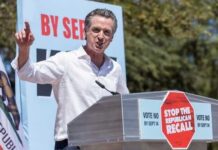 Gavin Newsom speaking at a podium, "Stop the Republican Recall."
