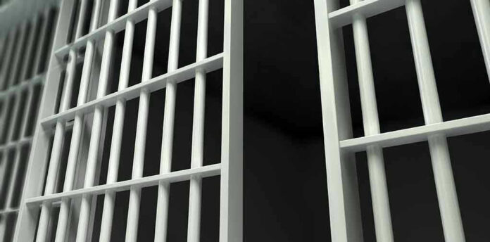 161438378 Close up of prison cell bars