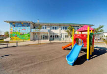 Colorful playground slide in front of a building