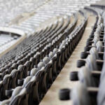 Stadium Cash Grab—Public Frustration Explodes Empty rows of gray seats in a stadium.
