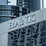 Trump Order STUNS Banks – Bank Injustice Exposed Bank building with glass facade and modern architecture.