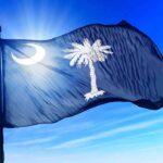 South Carolina state flag waving against a blue sky