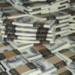 Fentanyl Cash Flood: U.S. Banks on HIGH ALERT Piles of bundled cash stacked together
