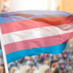 FBI PRESSURED: Transgender Advocacy as Terrorism? Transgender pride flag waving at outdoor event