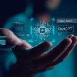 AI Expert Says We Should HALT AI Development Hand holding digital AI and ChatGPT graphics.