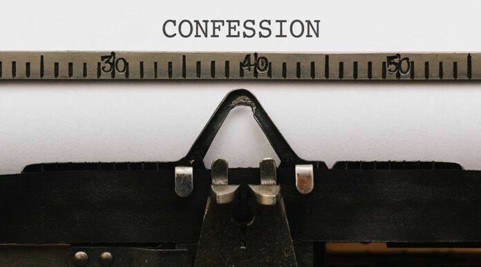 579321010 Typewriter with CONFESSION on paper