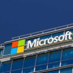 Are Landfills Done? Microsoft’s Radical CO₂ Move Microsoft logo on a modern corporate building against a blue sky