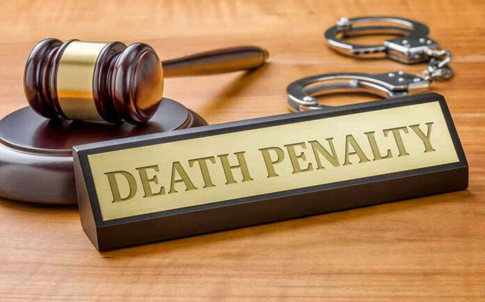 Gavel handcuffs and Death Penalty sign on desk