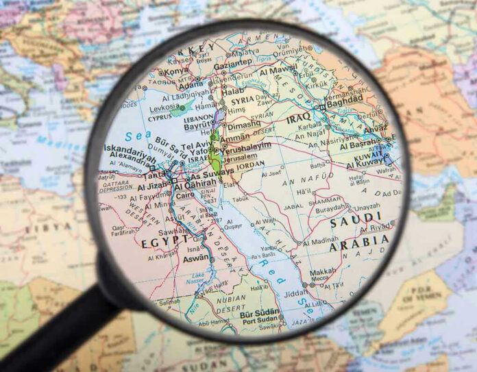 Magnifying glass over Middle East map highlighting Israel and Egypt
