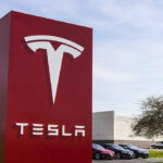 Tesla sign in front of dealership