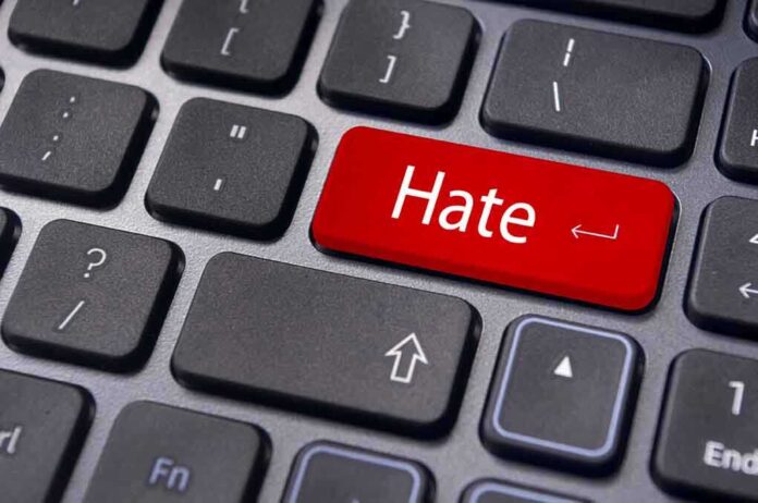 shutterstock_118178899.jpg Close-up of a keyboard with a red key labeled Hate