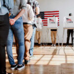MIND-BLOWING Voting Loophole Exposed In Minnesota People in line at voting booths.
