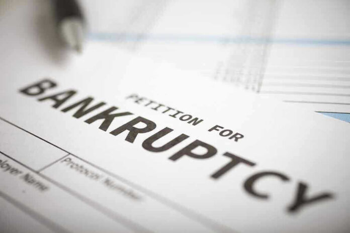 Petition for bankruptcy document with pen.