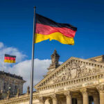 German Military FLEES Greenland After Trump Warning German flags at the Reichstag building in Berlin.