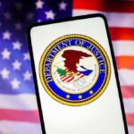 Century-Old GUN BAN CRUMBLES — Monumental DOJ MOVE Department of Justice emblem displayed on a smartphone with an American flag background
