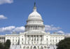 U.S. Capitol building against blue sky.