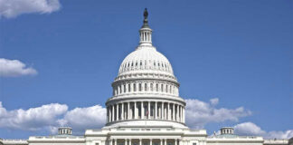 Congresswoman’s Husband: $51K to $30 MILLION Investigated U.S. Capitol building against blue sky.