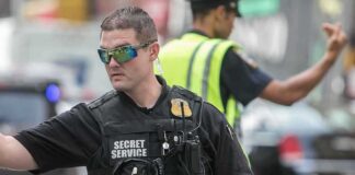 Secret Service ABANDONED – 71 Days Without Funding A Secret Service agent directing traffic in an urban setting