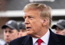 Trump Family Hit With Devastating Cancer Diagnosis! Man in suit and red tie speaking outside.