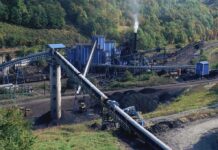 90 Workers Killed – COAL MINE TRAGEDY! Industrial coal processing facility with conveyor belts and smoke stack