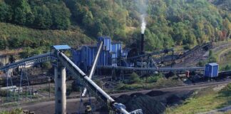 90 Workers Killed – COAL MINE TRAGEDY! Industrial coal processing facility with conveyor belts and smoke stack