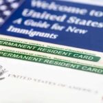 DOJ Launches Massive Citizenship Purge A guide for new immigrants alongside permanent resident cards and an American flag