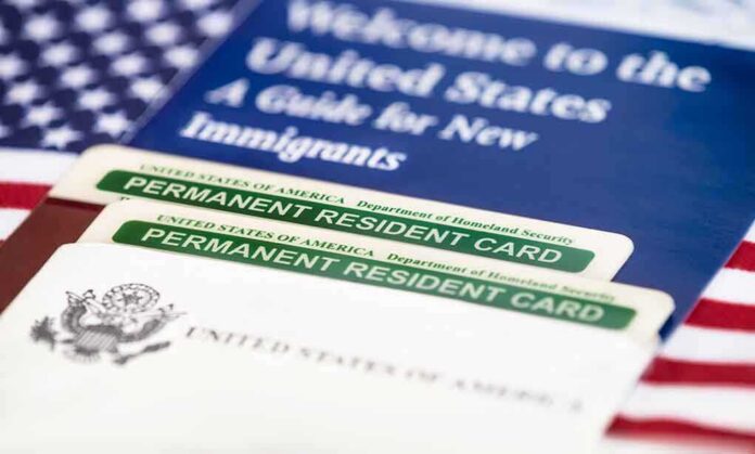 shutterstock_232231384-1 A guide for new immigrants alongside permanent resident cards and an American flag