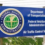 FAA Launches Investigation Into Controversial Musk Program! Sign for the Federal Aviation Administration at an air traffic control tower