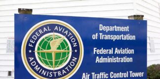 FAA Launches Investigation Into Controversial Musk Program! Sign for the Federal Aviation Administration at an air traffic control tower