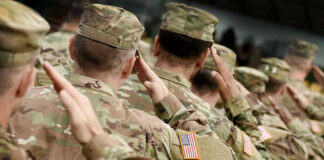 Woke Governor Tells Military To DEFY Trump Orders Soldiers in camouflage uniforms saluting in formation outdoors