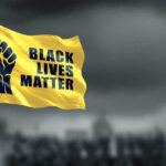 Black Panther Party INVADES Courthouse During Trial! Yellow Black Lives Matter flag with clenched fist.