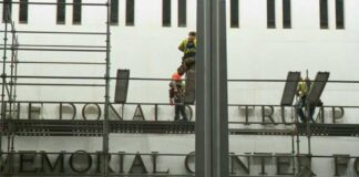 Workers begin removing Trump's name from Kennedy Center